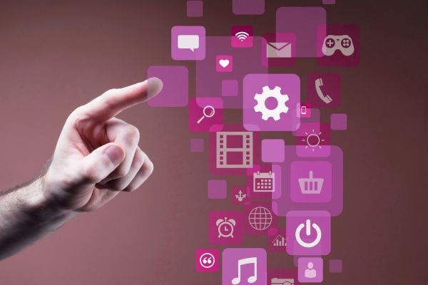 Hand pointing to a digital interface with connected application icons, illustrating API integration, data management and digital solutions